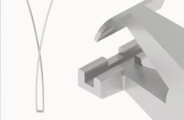 Open banding pliers next to clamped wire